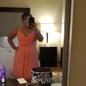 Floor length coral gown.